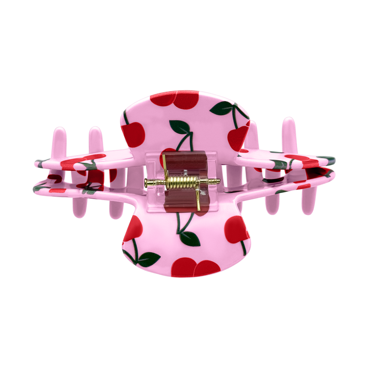 Top view of a pink cherry claw clip showing the spring and all-over cherry design.