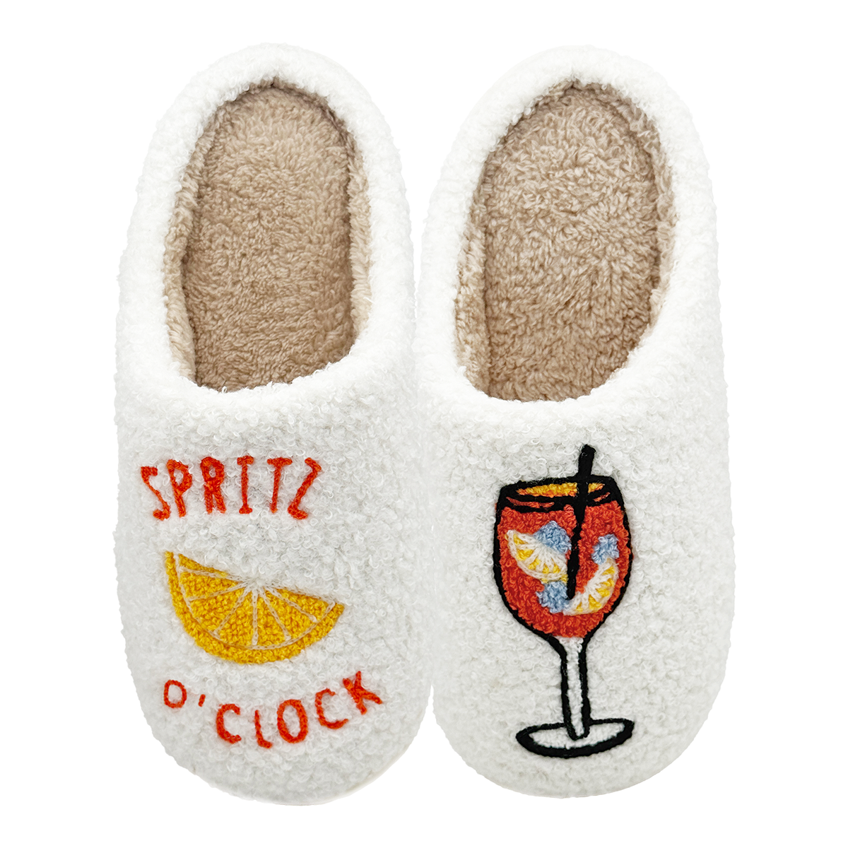 White slippers with embroidered text 'Spritz O’Clock' and an orange slice design on one slipper, and a colorful spritz cocktail glass on the other, on a white background.