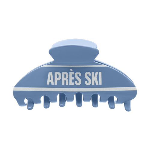 Front view of a blue claw clip with white “APRÈS SKI” text and horizontal white stripes on a white background.