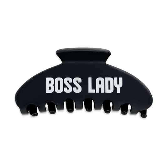 Front view of a black claw clip with bold white “BOSS LADY” text on a white background.