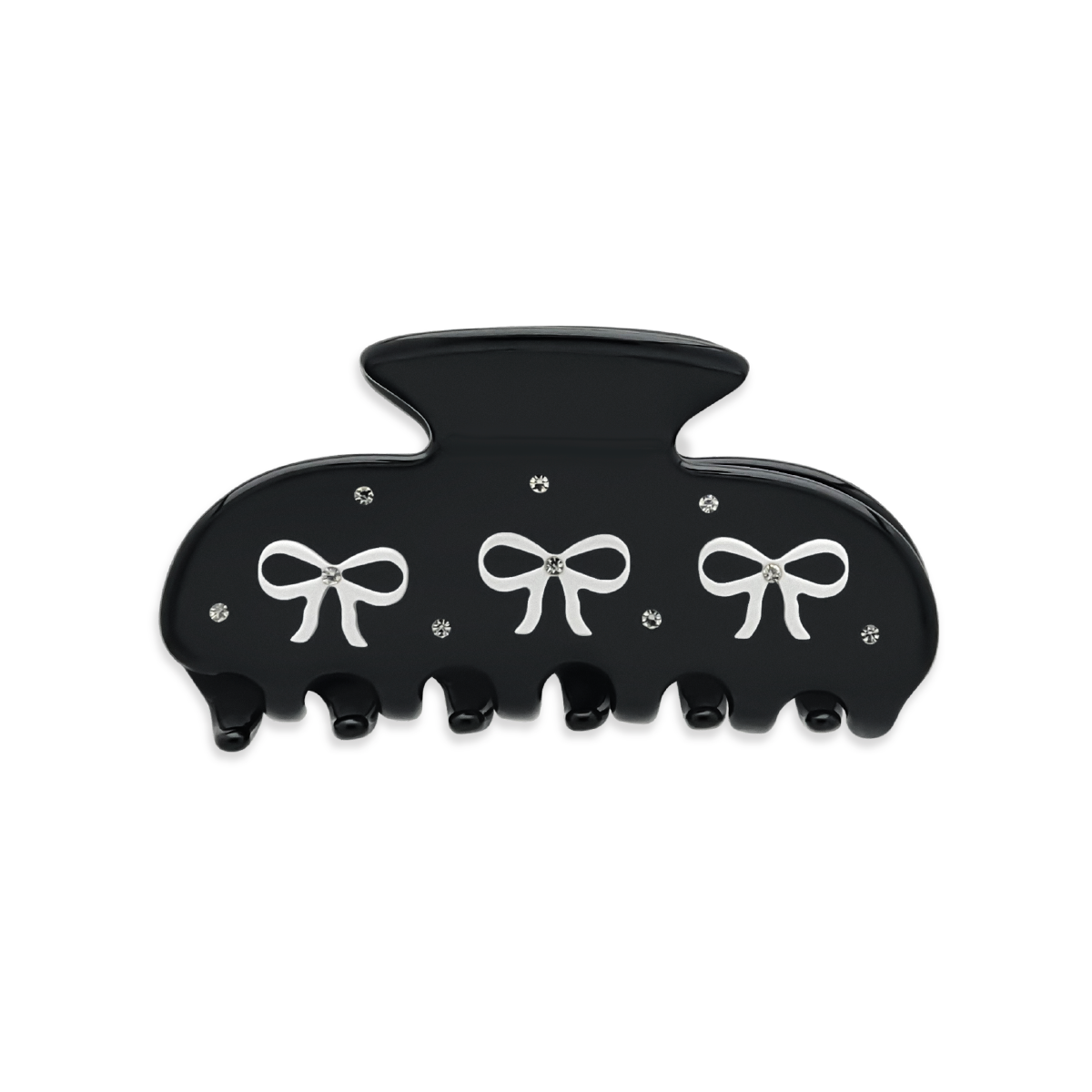 Front view of a black claw clip with three white bow graphics and silver rhinestones on a white background.