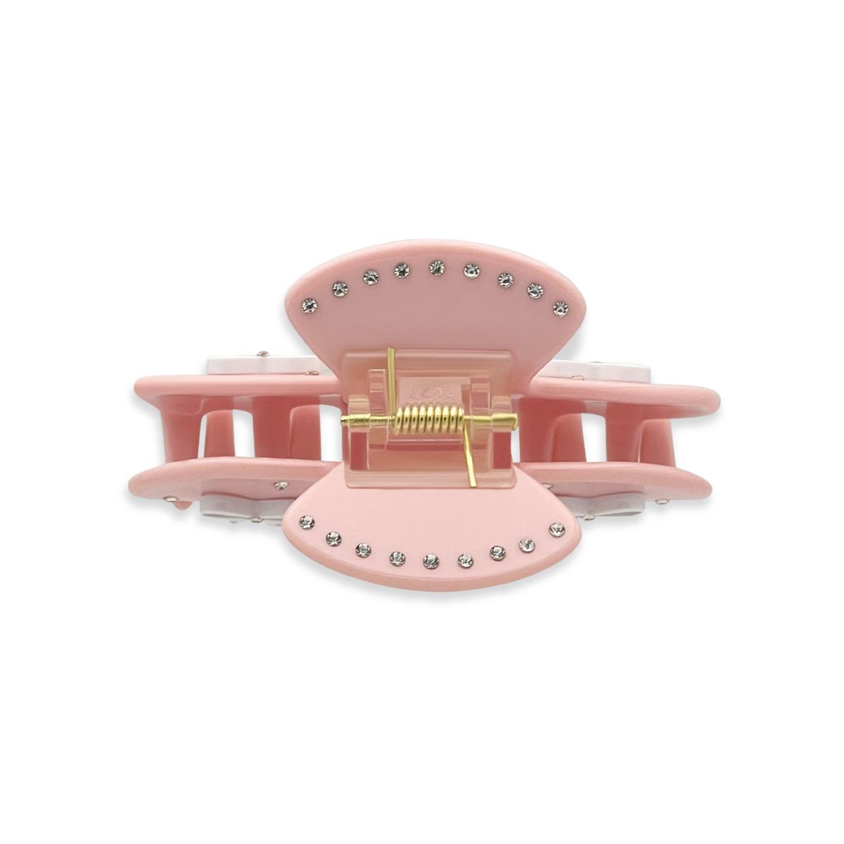 Top view of a light pink claw clip with silver rhinestones outlining the top edges and a visible gold spring mechanism on a white background.