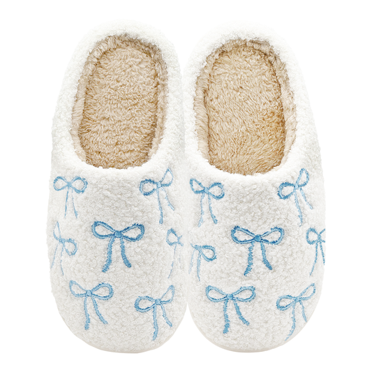 White fuzzy slippers with embroidered light blue bows