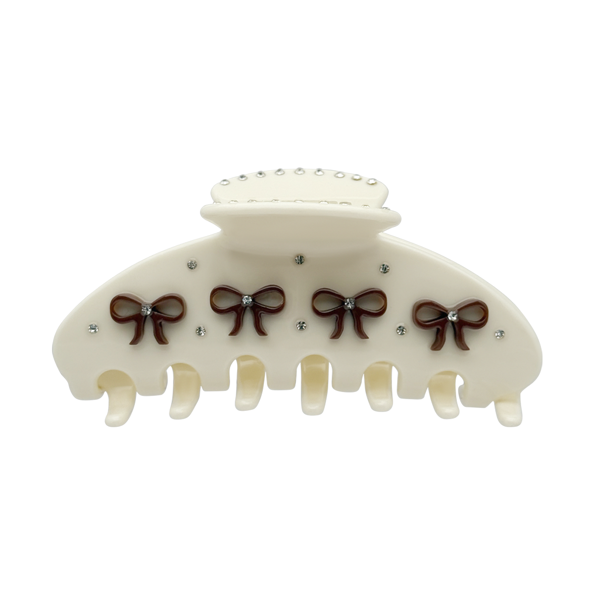Front view of a beige claw clip with brown bow designs and rhinestone accents