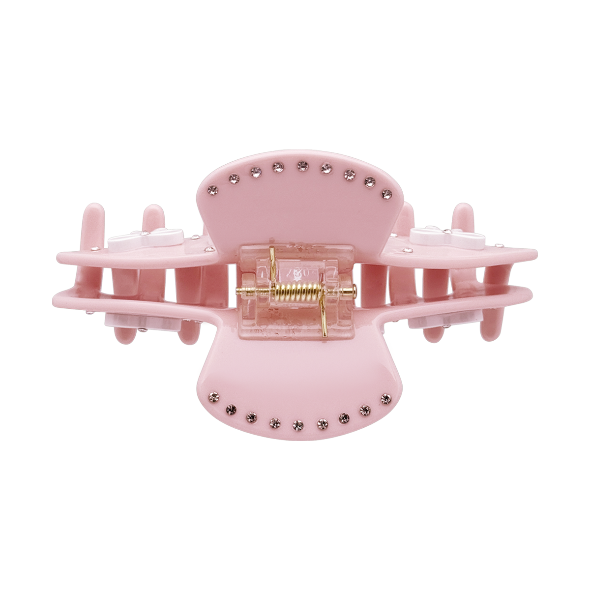 Top view of a pink bow claw clip showing the spring and rhinestone details