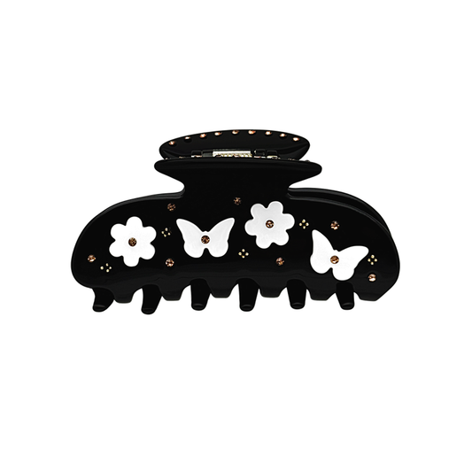 Front view of a black claw clip with contrasting butterfly and floral details.