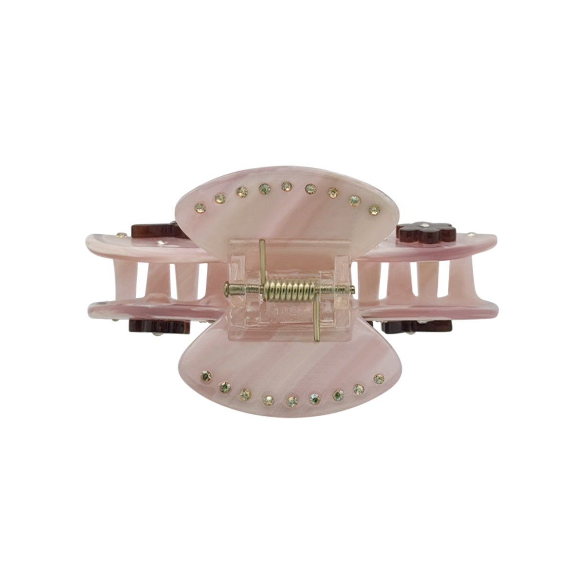 Top view of a rose beige claw clip showing gold rhinestones along the top edges, a gold spring mechanism, and side views of dark brown flower and butterfly graphics on a white background.