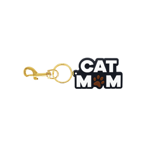 Black and white Cat Mom bag charm with paw print and gold-tone hardware