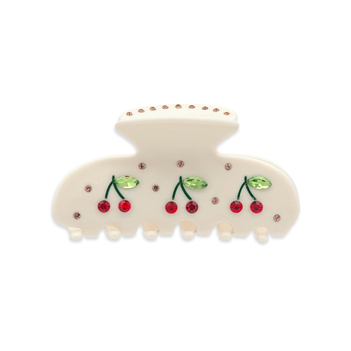 Front view of a beige claw clip with red cherry graphics with red rhinestones, green leaf accents with green rhinestones, and small gold rhinestones throughout and on the top, on a white background.