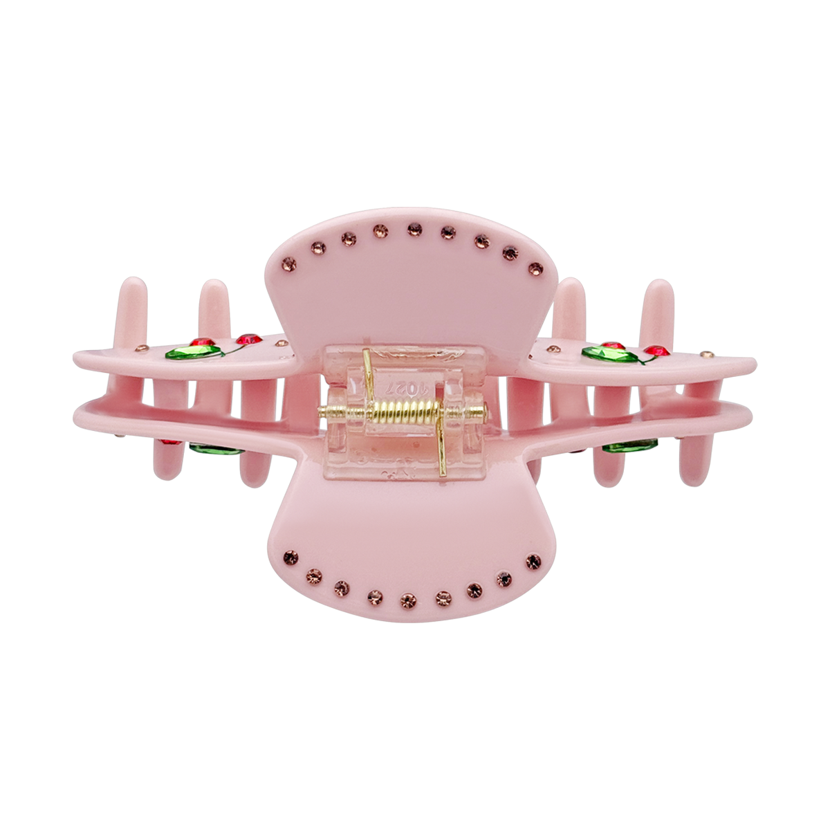 Top view of a pink cherry claw clip showing the spring and rhinestone details