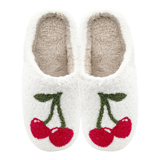 Pair of white slippers with cherry design on a white background