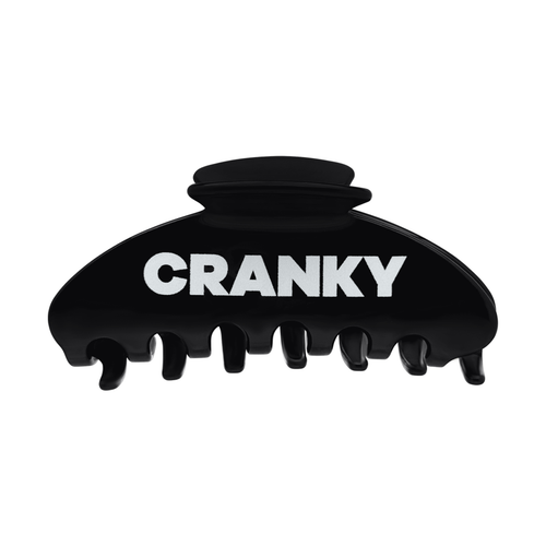 Front view of a black claw clip with bold white Cranky lettering.