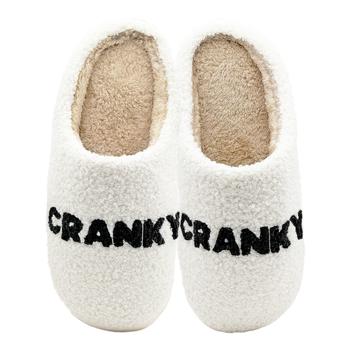 White fuzzy slippers with black CRANKY text