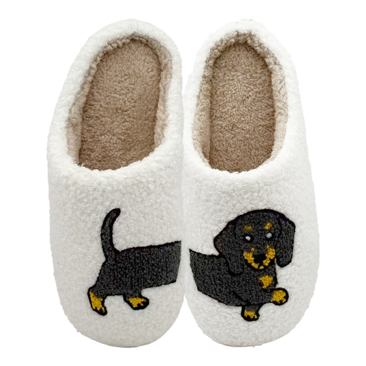 White slippers with dachshund design on a white background