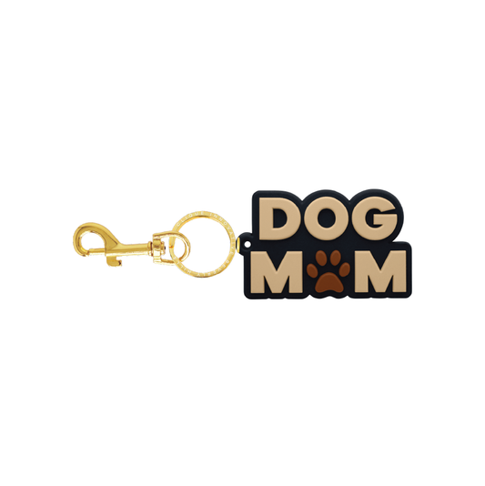 Black and beige Dog Mom bag charm with paw print and gold-tone hardware