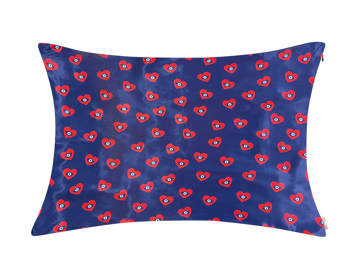 Navy satin pillowcase with an all-over red evil eye heart pattern.