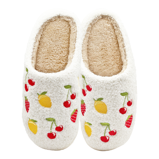 White fuzzy slippers with embroidered cherries, lemons, and strawberries