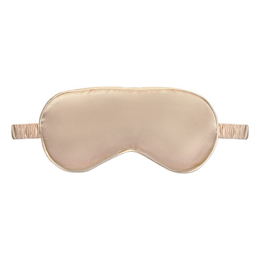 Front view of a gold satin sleep eye mask with an elastic ruched strap, shown on a white background.