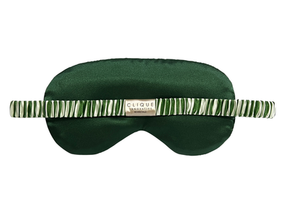 Back view of the green and white striped satin eye mask showing the elastic strap.