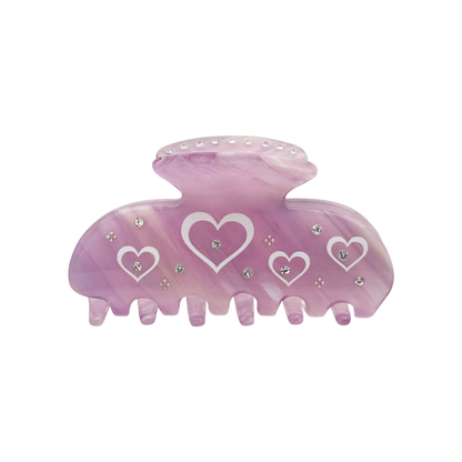 Front view of a blush mauve claw clip with multiple white heart-shaped graphics and small silver rhinestone accents on a white background.