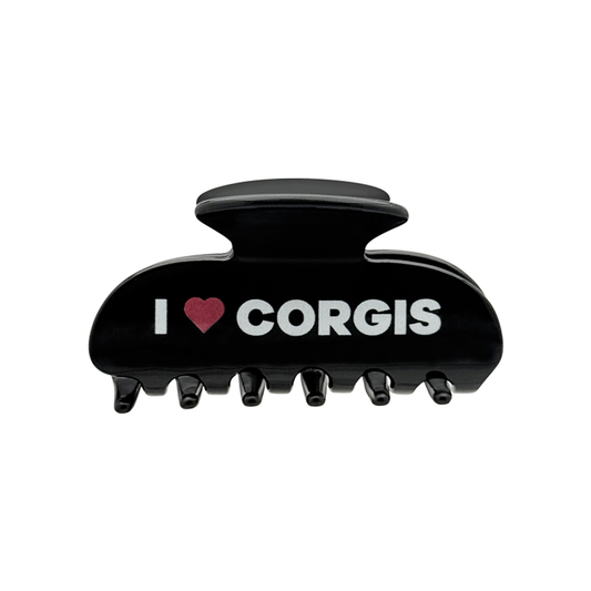 Front view of a black claw clip with white text that reads “I” followed by a red heart graphic and the word “CORGIS” on the front.