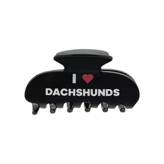 Front view of a black claw clip with white text that reads “I” followed by a red heart graphic and the word “DACHSHUNDS” on the front.