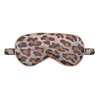 Front view of a leopard print satin sleep eye mask with a leopard print elastic ruched strap, shown on a white background.