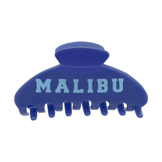Front view of a blue claw clip with light blue “MALIBU” text on the front.
