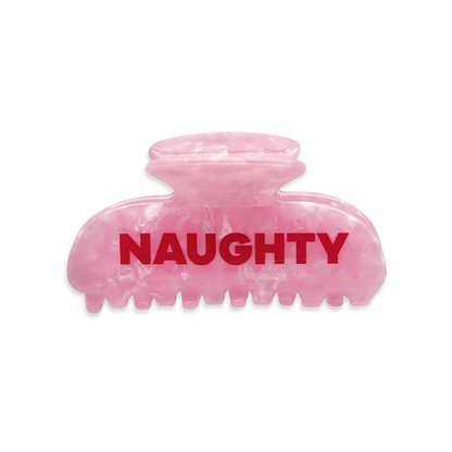 Pink marble claw clip with the word “NAUGHTY” in bold red lettering on the front.