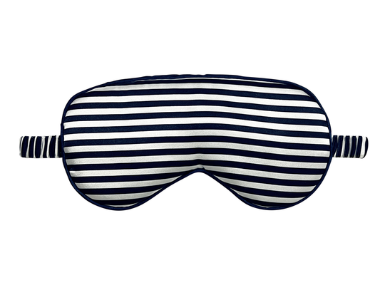 Front view of a navy blue and white striped satin eye mask.