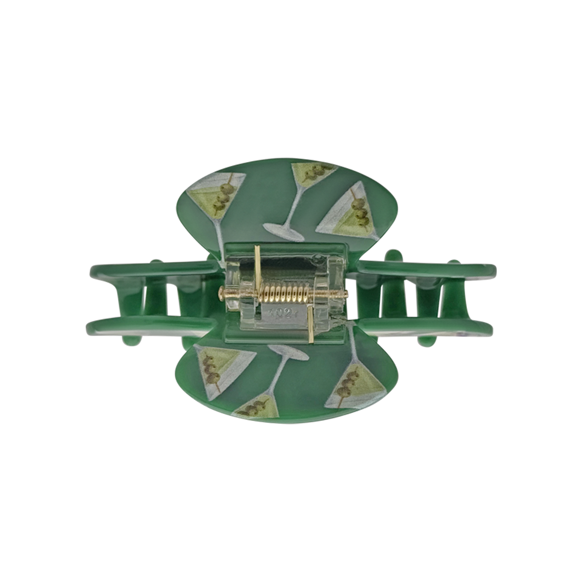 Top view of a green claw clip with martini glass pattern on a white background.