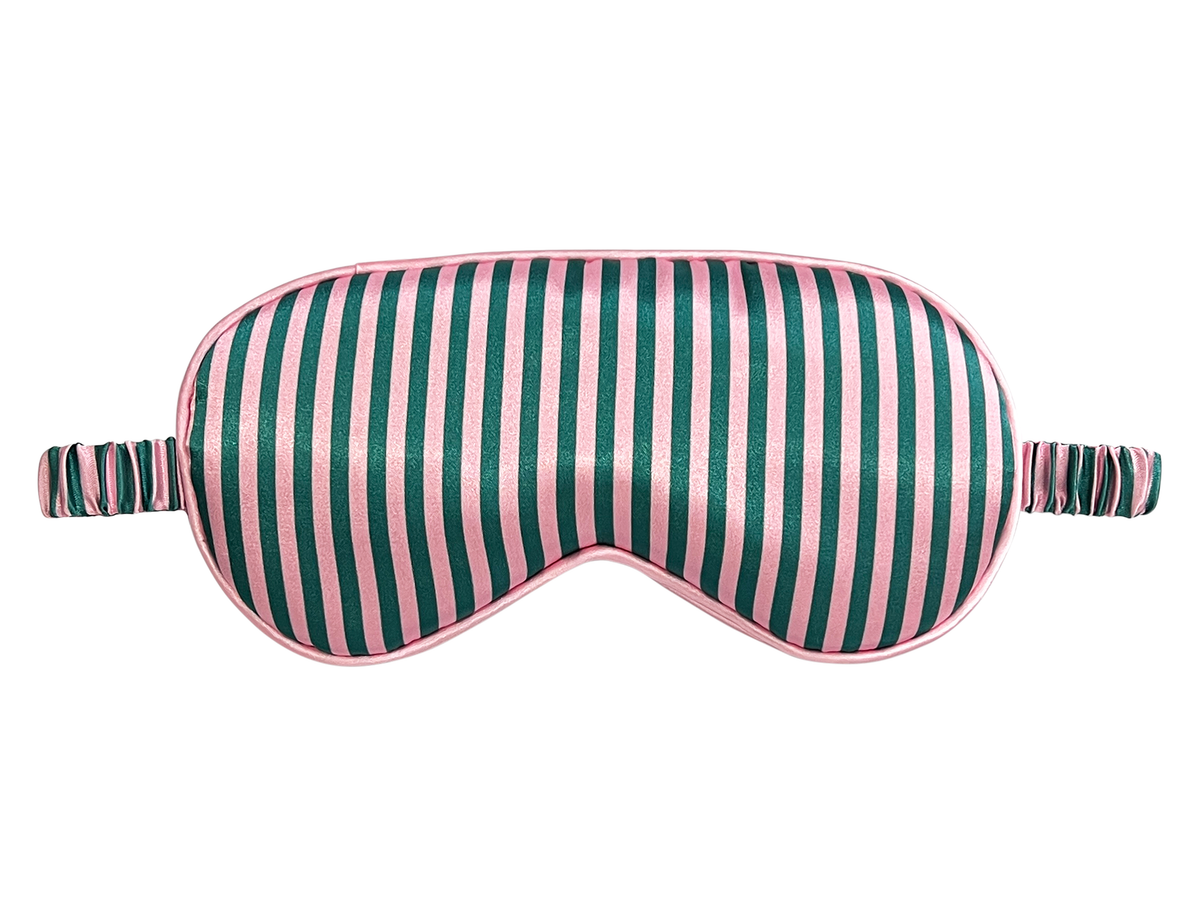 Front view of a pink, green, and white striped satin eye mask.