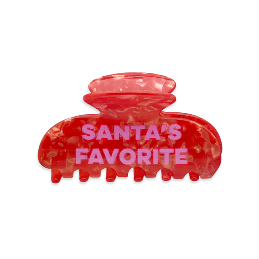 Front view of a red marble claw clip with “Santa’s Favorite” text on a white background.