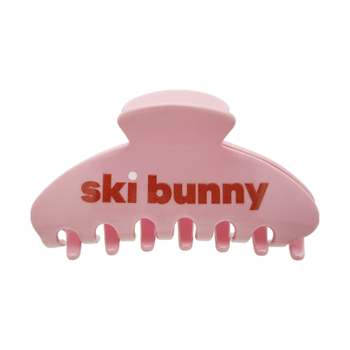 Front view of a blush pink claw clip with “ski bunny” text on a white background.