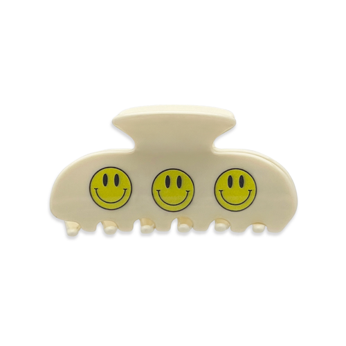 Front view of a beige claw clip with three yellow smiley face designs on a white background.