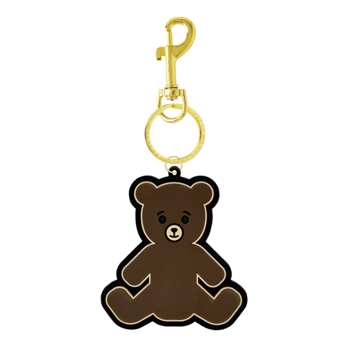 Brown teddy bear bag charm with a gold clasp and a gold split ring engraved with ‘Clique Innovative Beverly Hills,’ shown on a white background.