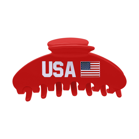 Front view of a red claw clip with white USA lettering and an American flag design.
